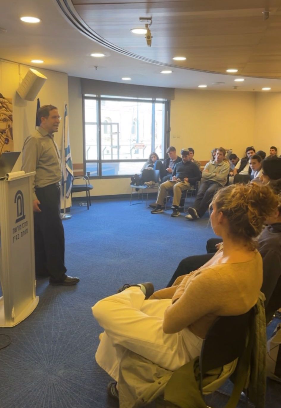 Gil Hoffman speaking to the fellows